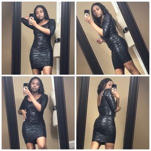 Black dress, half sleeve, liquid look dress.